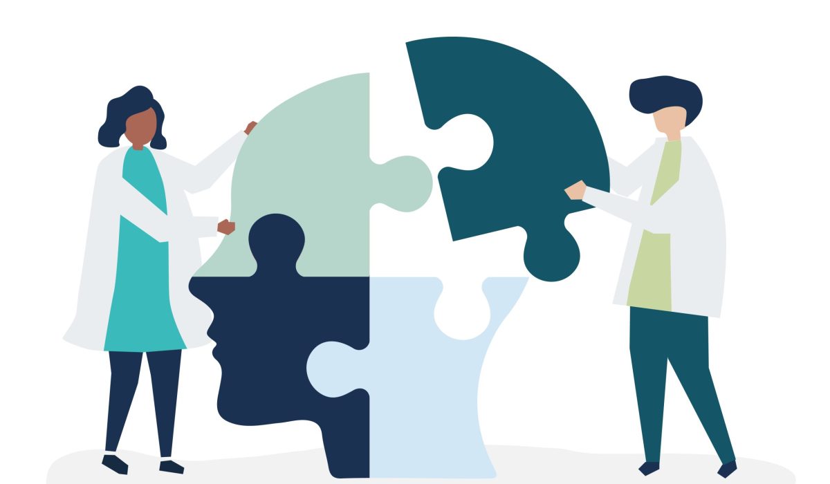 People connecting jigsaw pieces of a head together