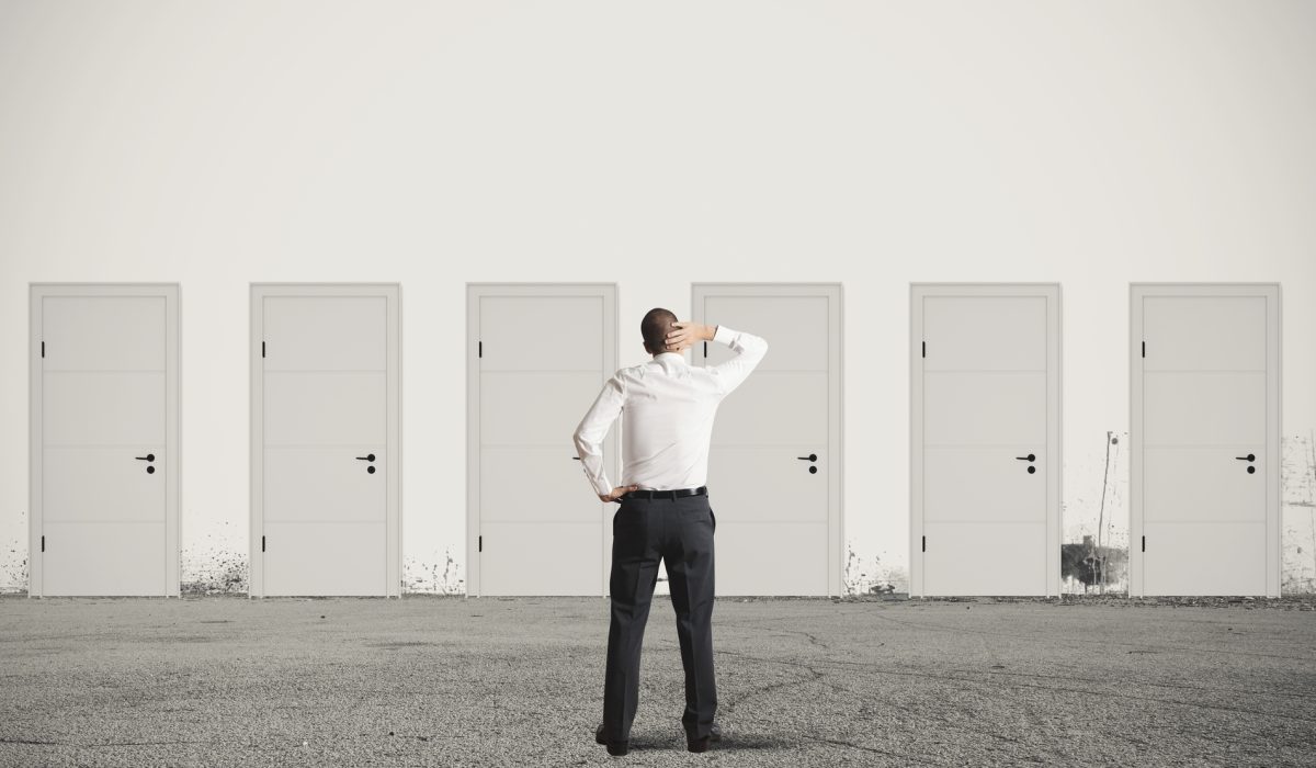 Concept of businessman choosing the right door